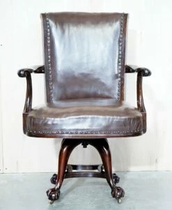 Antique Brown Leather Swivel Captains Chair With Claw & Ball Feet From Thomas Chippendale -PAMONO Sales antique brown leather swivel captains chair with claw ball feet from thomas chippendale 3