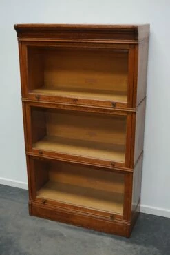 PAMONO Sales -PAMONO Sales german oak bookcase with folding doors in style of globe wernicke 1900s 2